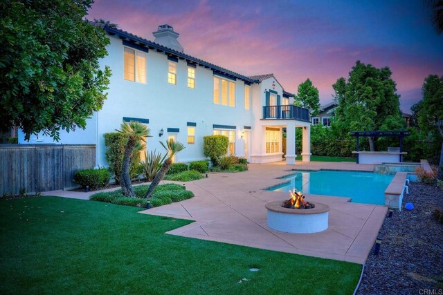 1664 Aryana Dr, Encinitas, CA 92024 - pool at dusk featuring a fire pit, a patio, and a pergola