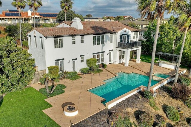 1664 Aryana Dr, Encinitas, CA 92024 - rear view of property with a balcony, a patio, a chimney, stucco siding, and a tile roof