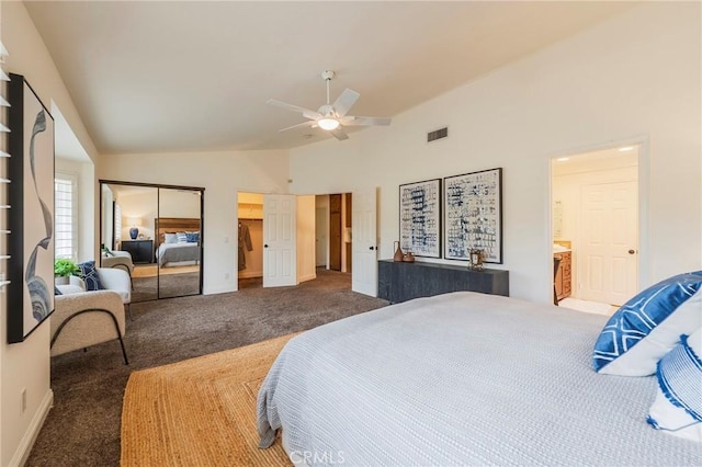 bedroom with a closet, baseboards, carpet flooring, visible vents, and high vaulted ceiling