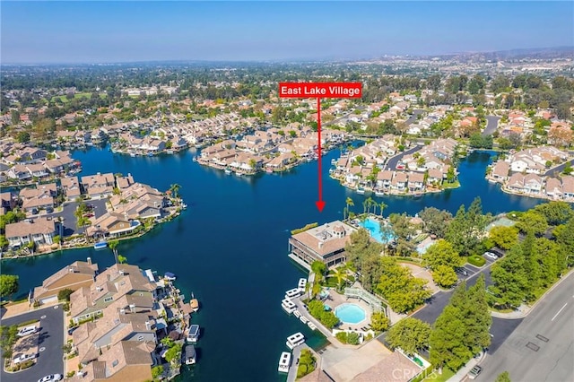 bird's eye view featuring a water view and a residential view