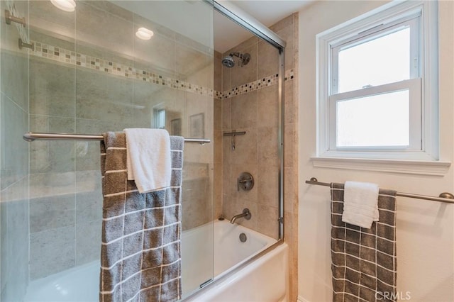 full bathroom with shower / bath combination with glass door