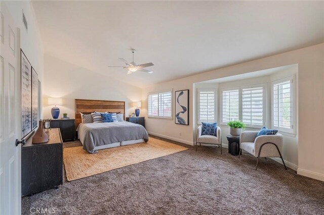 carpeted bedroom with visible vents, baseboards, a ceiling fan, and lofted ceiling