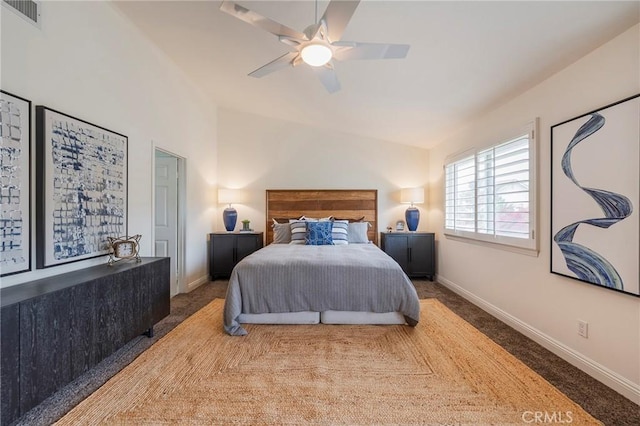 carpeted bedroom with visible vents, baseboards, ceiling fan, and vaulted ceiling