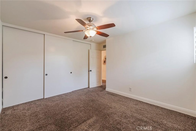 unfurnished bedroom with carpet flooring, visible vents, a closet, and ceiling fan