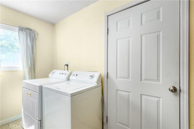 11947 Vivienda Ct, Grand Terrace, CA 92313 - washroom featuring independent washer and dryer, baseboards, laundry area, and a textured ceiling