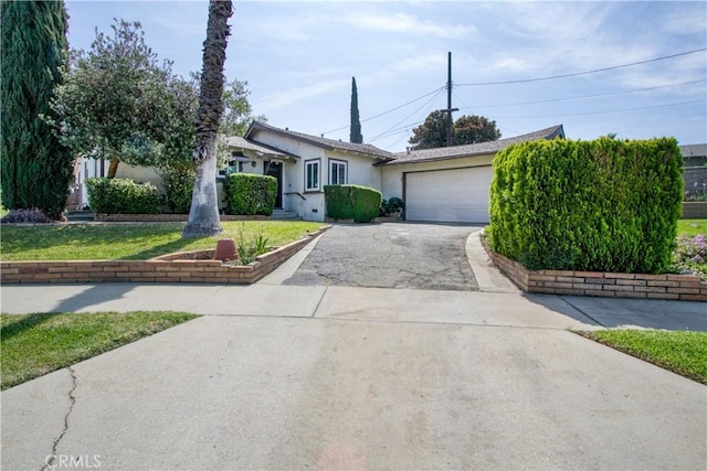 11947 Vivienda Ct, Grand Terrace, CA 92313 - ranch-style home featuring driveway, stucco siding, and an attached garage