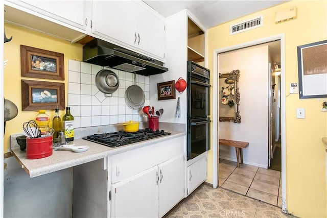 11947 Vivienda Ct, Grand Terrace, CA 92313 - kitchen featuring light countertops, under cabinet range hood, visible vents, decorative backsplash, and black appliances