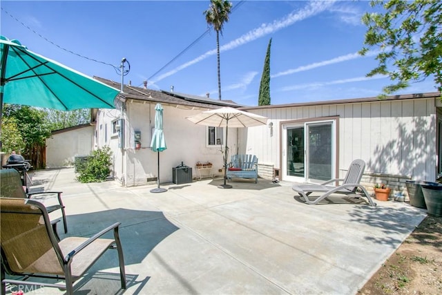 11947 Vivienda Ct, Grand Terrace, CA 92313 - back of house with solar panels and a patio