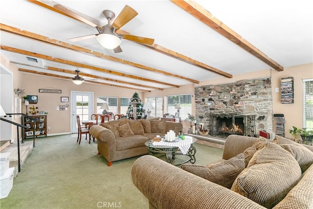 11947 Vivienda Ct, Grand Terrace, CA 92313 - living area featuring a stone fireplace, light carpet, a ceiling fan, visible vents, and beam ceiling