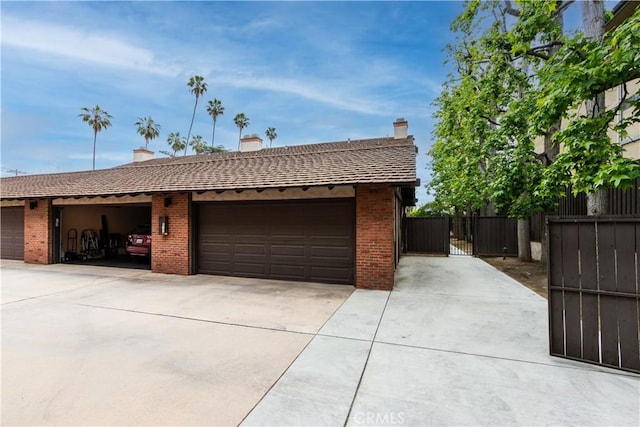 506 W Sierra Madre Blvd Unit D, Sierra Madre, CA 91024 - garage featuring fence, a gate, and a garage