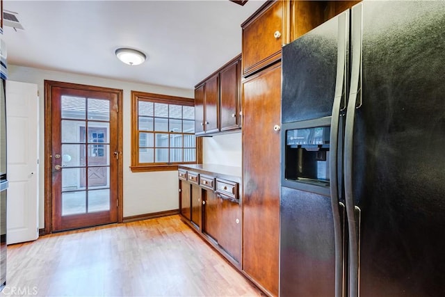 506 W Sierra Madre Blvd Unit D, Sierra Madre, CA 91024 - kitchen featuring baseboards, light wood-style flooring, black fridge, and visible vents