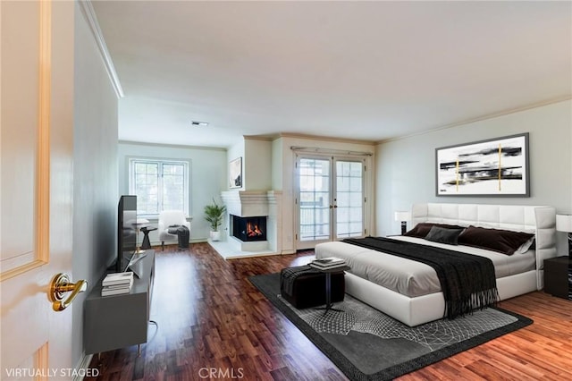 506 W Sierra Madre Blvd Unit D, Sierra Madre, CA 91024 - bedroom with access to outside, a warm lit fireplace, ornamental molding, and wood finished floors