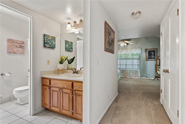 2403 Holly Ave, Chico, CA 95926 - bathroom with toilet, vanity, and ceiling fan