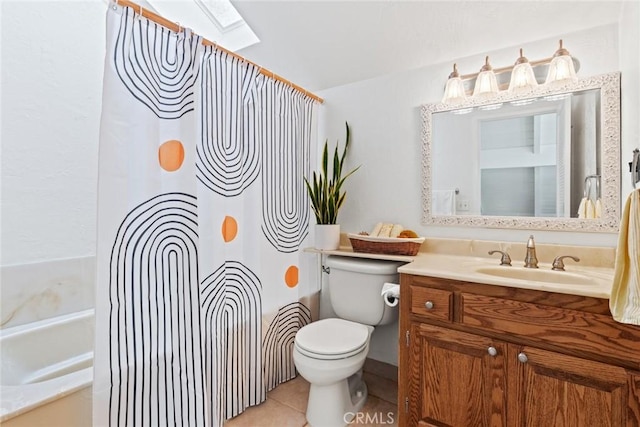 2403 Holly Ave, Chico, CA 95926 - bathroom featuring toilet, a skylight, vanity, tile patterned floors, and shower / bath combo