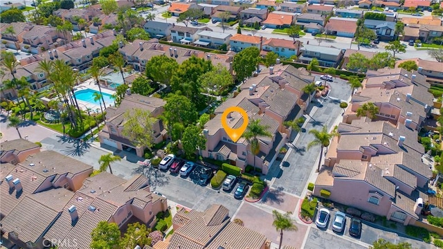 birds eye view of property with a residential view