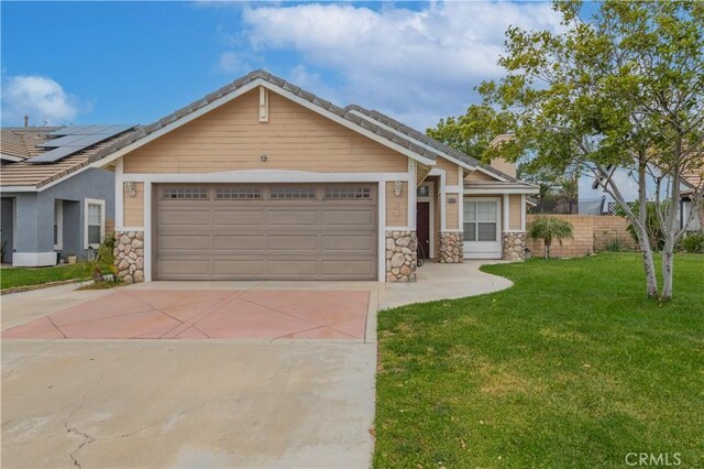 14850 Filly Ln, Fontana, CA 92336 - craftsman-style house featuring a front yard, stone siding, a garage, and concrete driveway