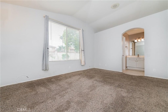 14850 Filly Ln, Fontana, CA 92336 - carpeted empty room with arched walkways and vaulted ceiling