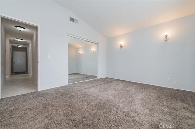 14850 Filly Ln, Fontana, CA 92336 - unfurnished bedroom featuring a closet, visible vents, carpet, and vaulted ceiling