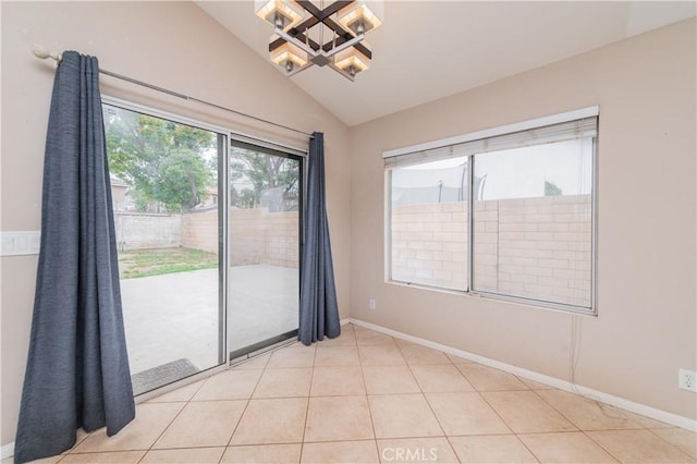 14850 Filly Ln, Fontana, CA 92336 - empty room featuring light tile patterned flooring, baseboards, an inviting chandelier, and lofted ceiling
