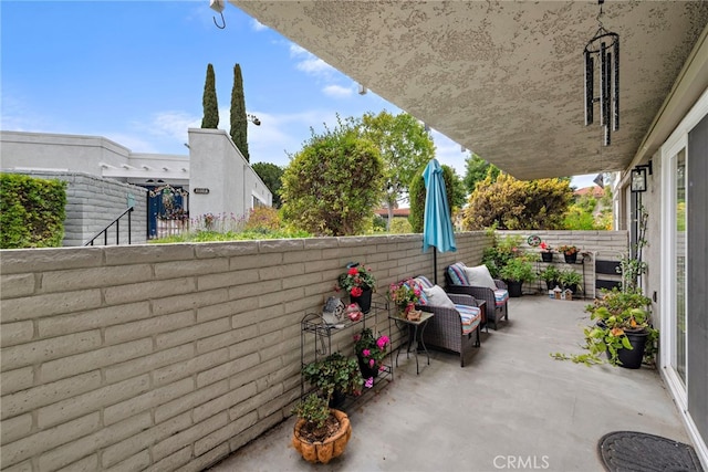 view of patio / terrace with an outdoor living space and a fenced backyard
