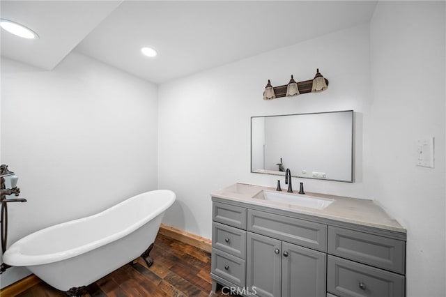781 Arbula Dr, Crestline, CA 92325 - bathroom featuring recessed lighting, a freestanding bath, wood finished floors, and vanity