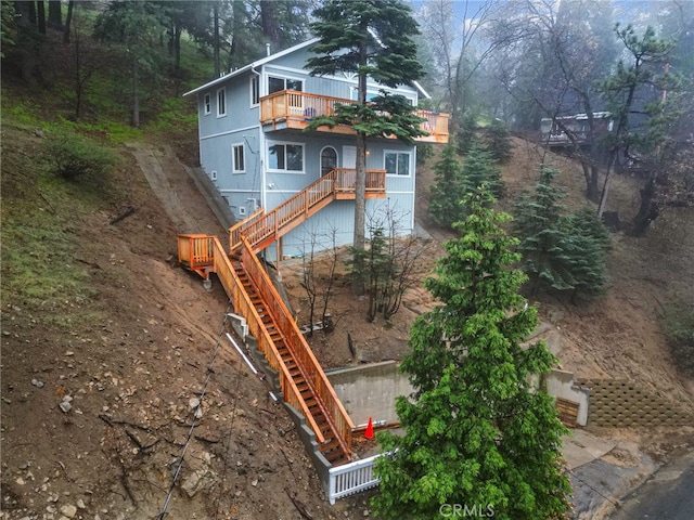781 Arbula Dr, Crestline, CA 92325 - back of house featuring stairs