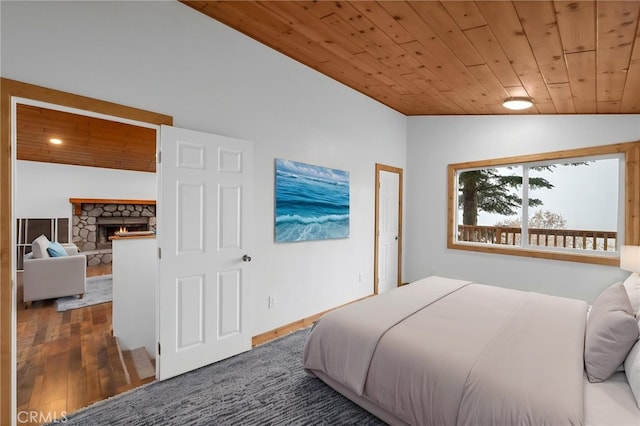 781 Arbula Dr, Crestline, CA 92325 - bedroom featuring vaulted ceiling, wood finished floors, a fireplace, and wood ceiling