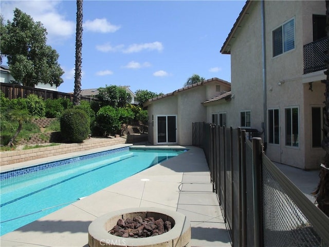 22956 Akwo Cir, Wildomar, CA 92595 - view of swimming pool with an outdoor fire pit, fence, and a patio area