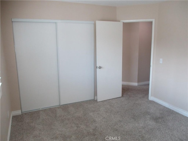 22956 Akwo Cir, Wildomar, CA 92595 - unfurnished bedroom featuring carpet floors, a closet, and baseboards