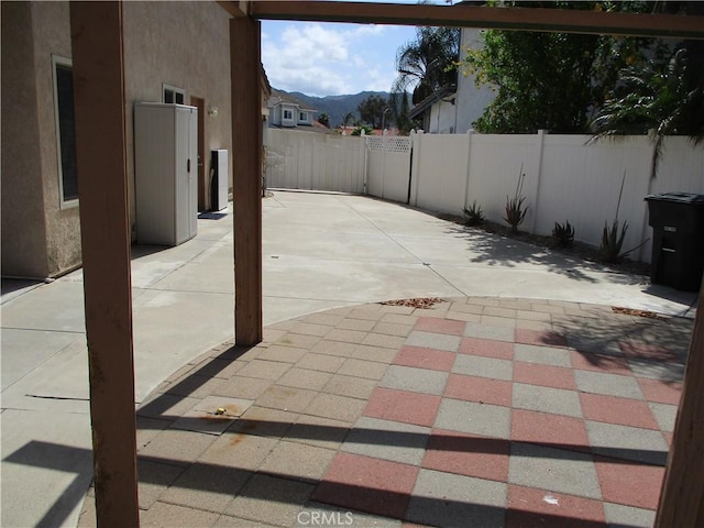 22956 Akwo Cir, Wildomar, CA 92595 - view of patio featuring a fenced backyard and a mountain view