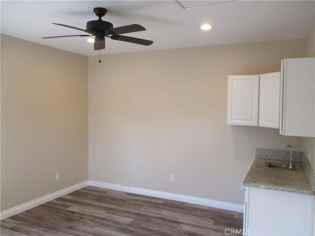 22956 Akwo Cir, Wildomar, CA 92595 - unfurnished dining area featuring a ceiling fan, wood finished floors, recessed lighting, a sink, and baseboards