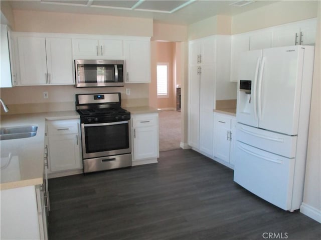22956 Akwo Cir, Wildomar, CA 92595 - kitchen featuring stainless steel appliances, a sink, dark wood-type flooring, and white cabinets