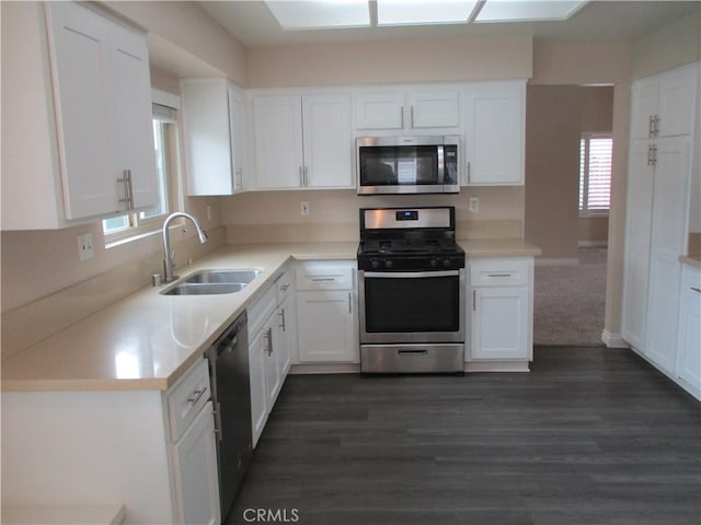 22956 Akwo Cir, Wildomar, CA 92595 - kitchen featuring stainless steel appliances, a sink, white cabinets, dark wood-type flooring, and light countertops