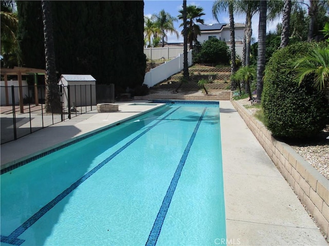 22956 Akwo Cir, Wildomar, CA 92595 - view of swimming pool with fence and a patio area