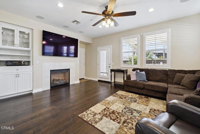 living area with visible vents, recessed lighting, ceiling fan, and a fireplace