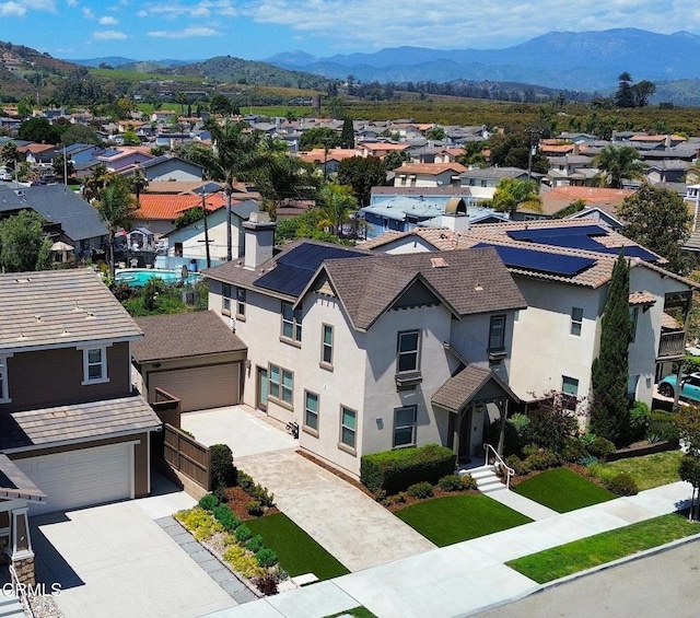 birds eye view of property featuring a mountain view and a residential view