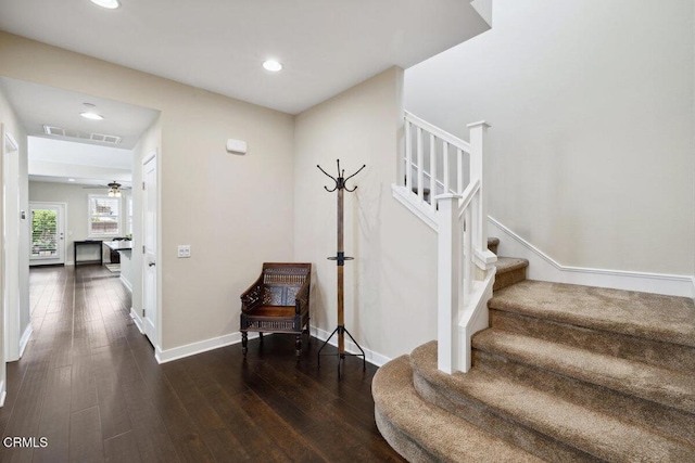 staircase with recessed lighting, baseboards, visible vents, and hardwood / wood-style flooring