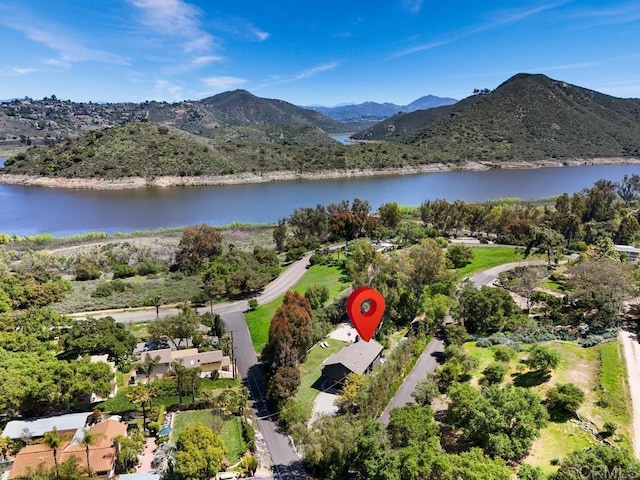 birds eye view of property featuring a water and mountain view