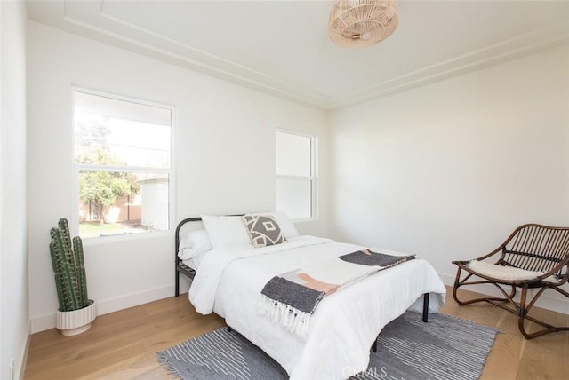 3540 S Sycamore Ave, Los Angeles, CA 90016 - bedroom featuring baseboards and wood finished floors