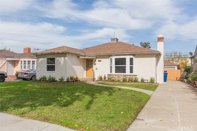 3540 S Sycamore Ave, Los Angeles, CA 90016 - view of front of property with stucco siding and a front yard