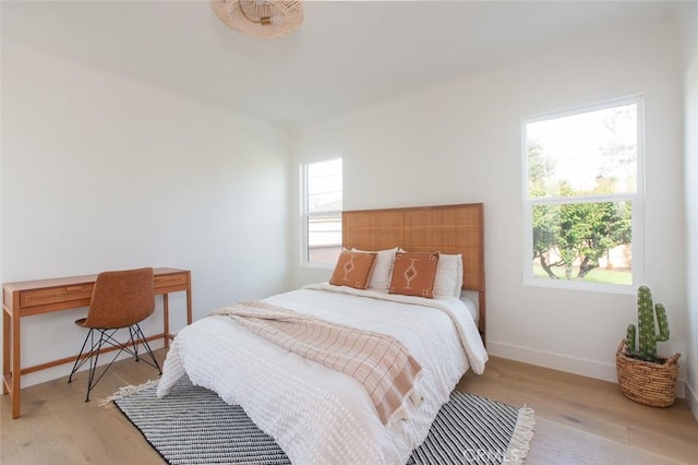 3540 S Sycamore Ave, Los Angeles, CA 90016 - bedroom with baseboards and wood finished floors