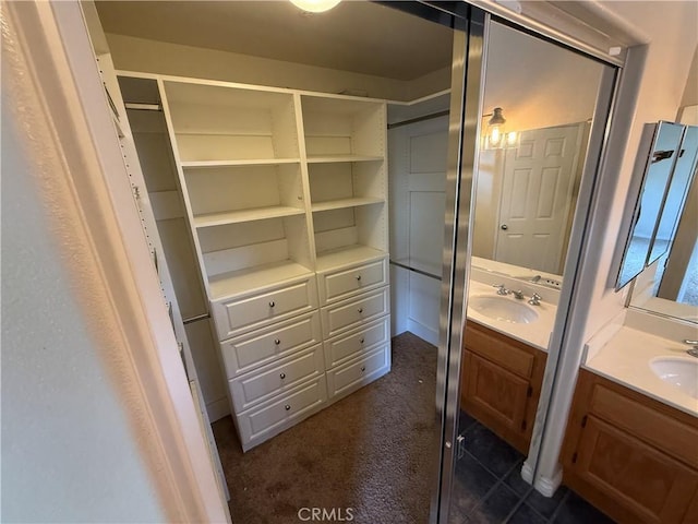 full bathroom featuring two vanities and a sink
