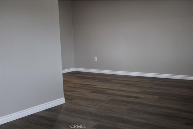 26231 Pine Valley Rd, Menifee, CA 92586 - unfurnished room with dark wood-style flooring and baseboards