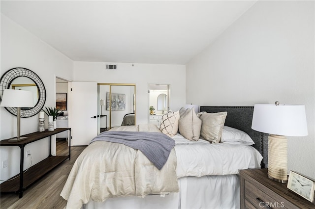 255 S Avenida Caballeros Unit 106, Palm Springs, CA 92262 - bedroom featuring wood finished floors, a closet, and visible vents