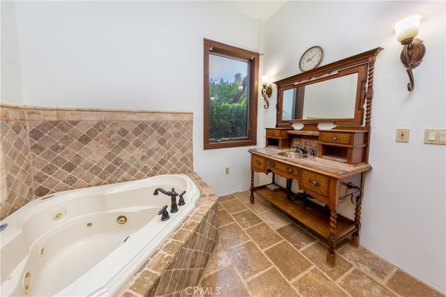 32140 Windrush Rd, Agua Dulce, CA 91390 - bathroom featuring a jetted tub, vanity, and stone finish floor