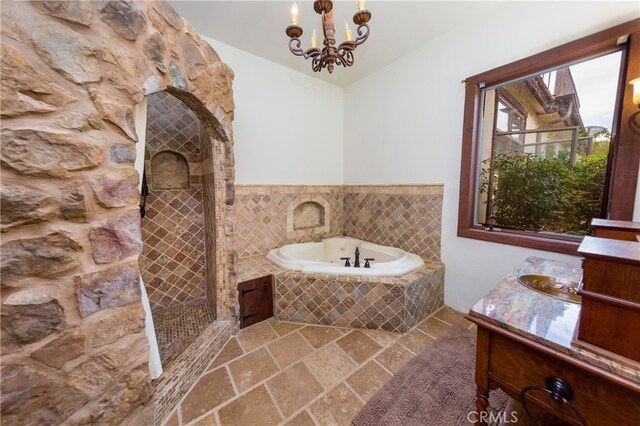32140 Windrush Rd, Agua Dulce, CA 91390 - bathroom featuring a tile shower, a garden tub, stone tile floors, vanity, and a notable chandelier