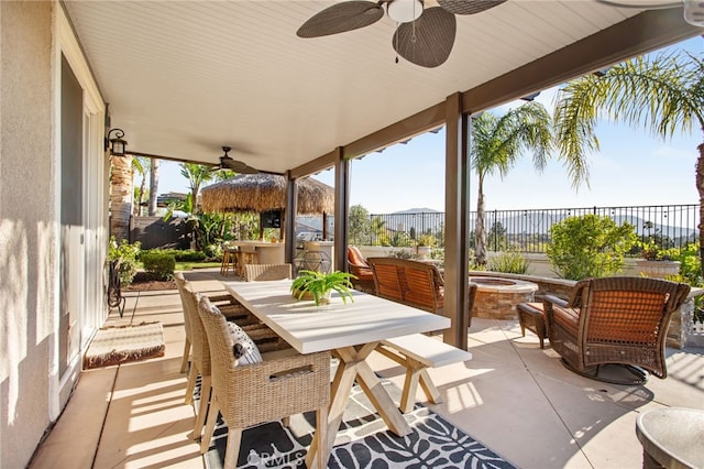 33081 Yucca St, Temecula, CA 92592 - view of patio featuring ceiling fan, fence, outdoor dining space, and a fire pit
