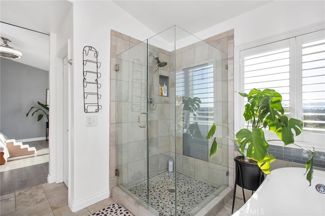 33081 Yucca St, Temecula, CA 92592 - full bath featuring a stall shower, a freestanding tub, and baseboards