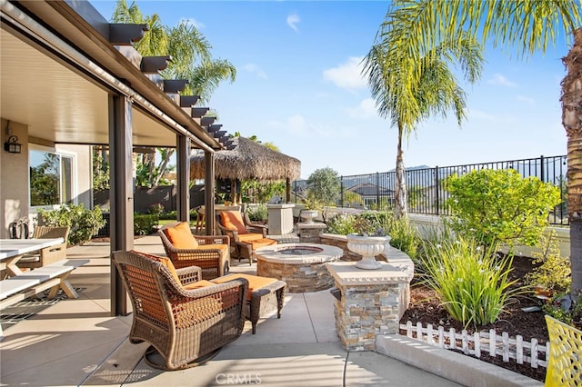 33081 Yucca St, Temecula, CA 92592 - view of patio featuring an outdoor fire pit and a fenced backyard