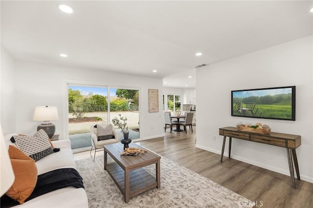 27192 Howard St, Menifee, CA 92586 - living room featuring wood finished floors and recessed lighting